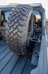 Picture of Jeep Gladiator Tire Carrier Universal Stand Up In Bed For 19+ Gladiator DV8